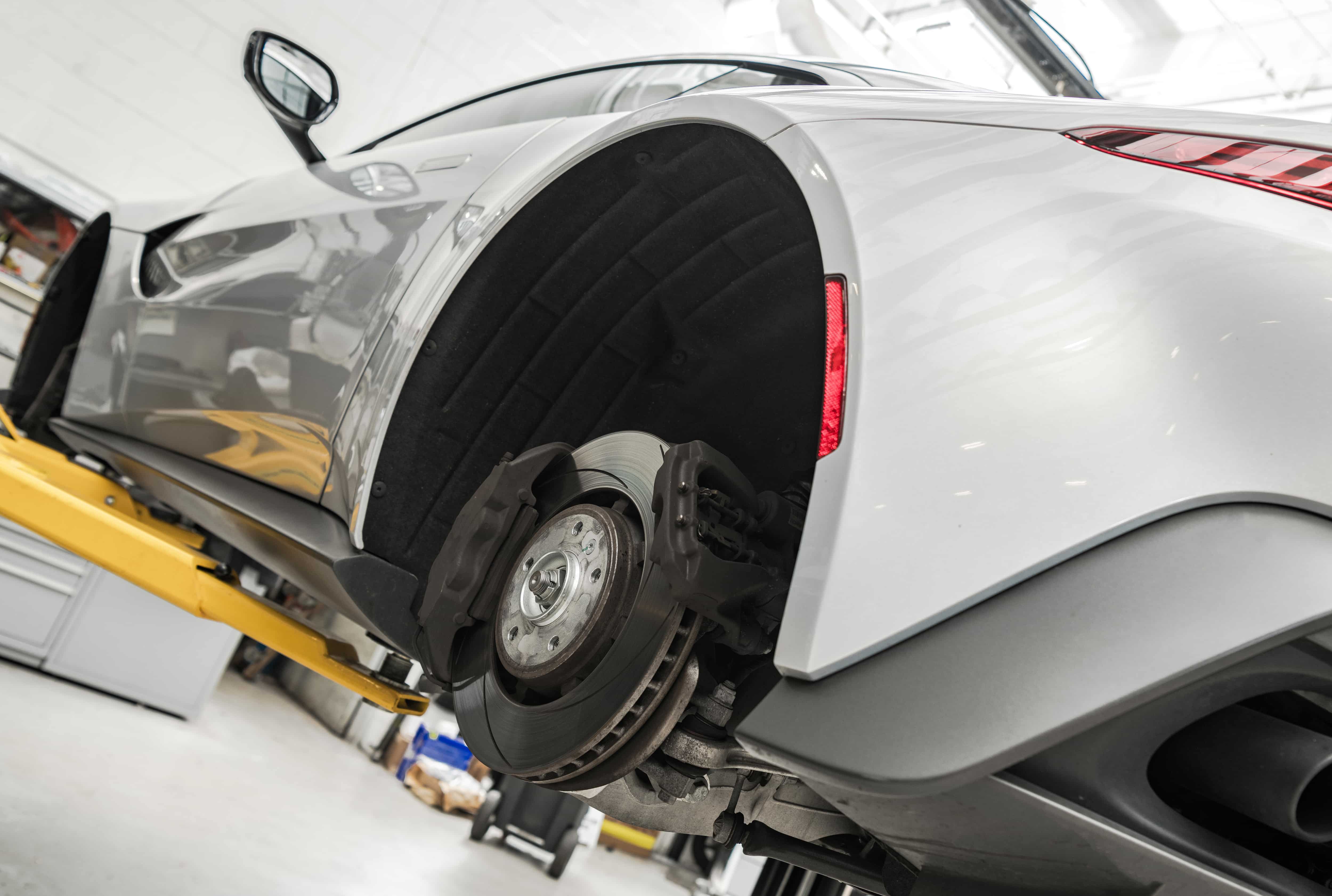 Car Servicing & Repairs in Broadmeadows Professional car brake repair service in Broadmeadows - Expert technician installing brake disc